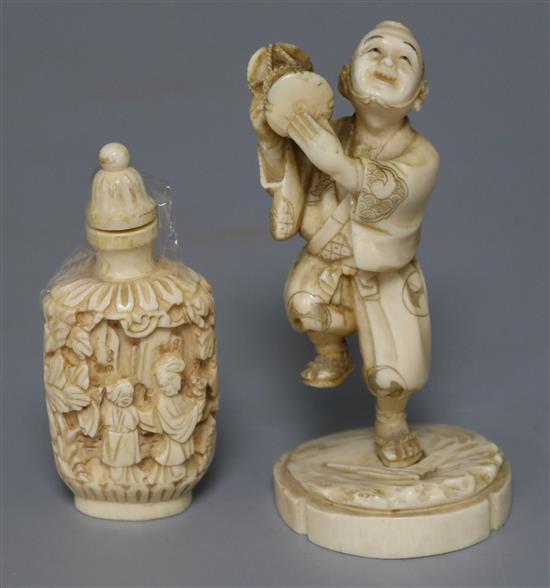 An ivory snuff bottle and a Japanese ivory dancer